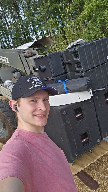 Benjamin with a line array system loaded for an event